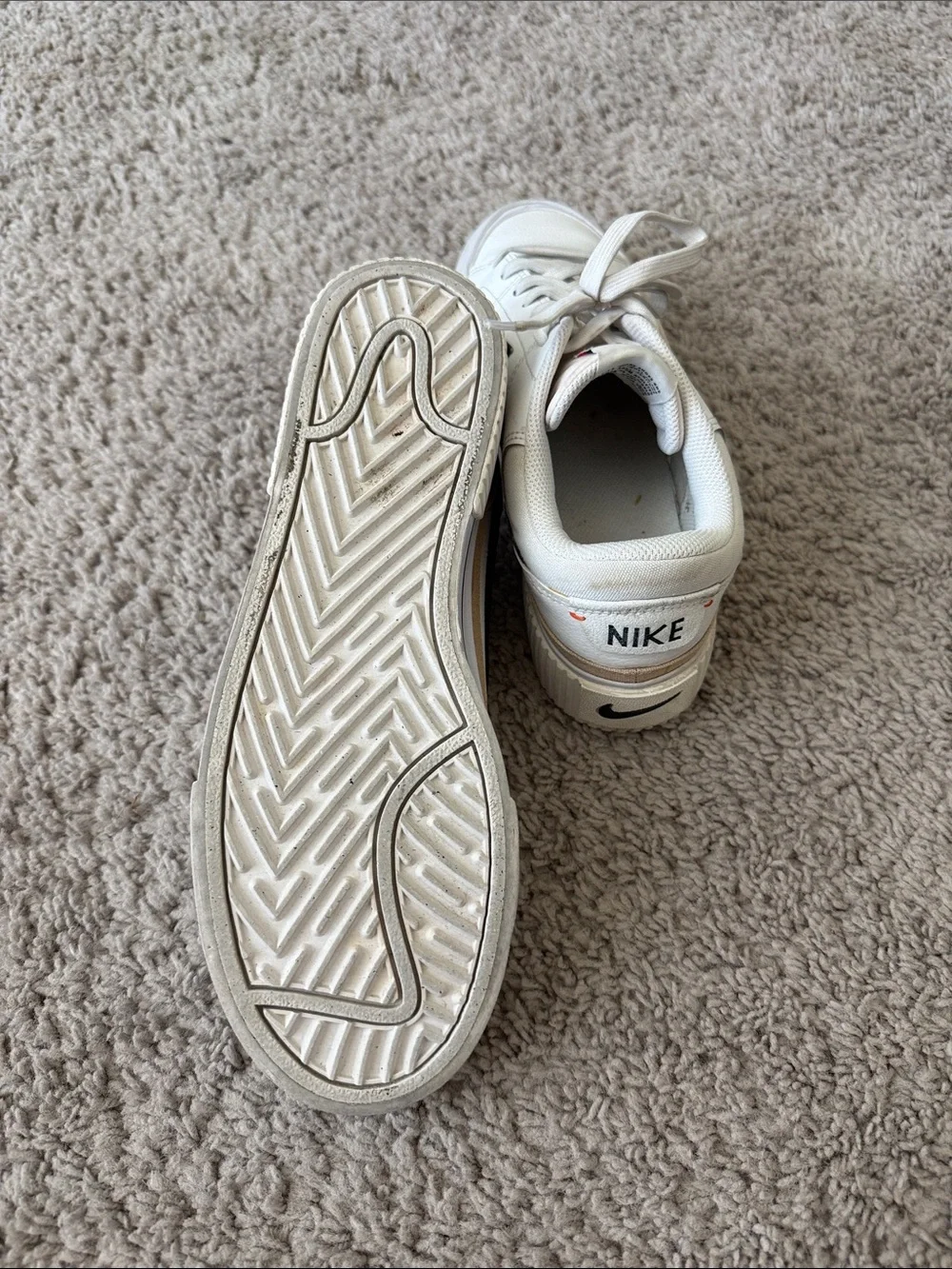 Nike White Low-Top Sneakers with Black Swoosh and Tan Trim
